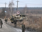 Ukrainian servicemen stand near an armored personnel carrier BTR-3 on the northwest of Kyiv. Ukrainian servicemen stand near an armored personnel carrier BTR-3 on the northwest of Kyiv.