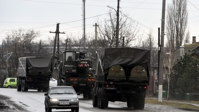 Russian military vehicles move on a road in the southern Russian Rostov region on February 24, 2022. (AFP) Russian military vehicles move on a road in the southern Russian Rostov region on February 24, 2022. (AFP)
