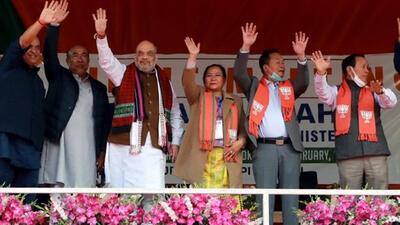 Union Home Minister Amit Shah, Manipur Chief Minister N Biren Singh and others wave to supporters during a public meeting ahead of the Manipur Assembly elections, in Churachandpur on Wednesday. (ANI PHOTO.) Union Home Minister Amit Shah, Manipur Chief Minister N Biren Singh and others wave to supporters during a public meeting ahead of the Manipur Assembly elections, in Churachandpur on Wednesday. (ANI PHOTO.)