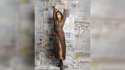 Richa Chadha was seen wearing a long front slit buttoned checkered dress that featured two brown leather pockets and collars. (Instagram/@therichachadha) Richa Chadha was seen wearing a long front slit buttoned checkered dress that featured two brown leather pockets and collars. (Instagram/@therichachadha)