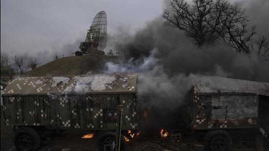 Smoke rises from an air defence base in the aftermath of an apparent Russian strike in Mariupol, Ukraine on Thursday. (AP PHOTO.)