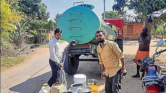 Villagers fetching water from tankers that are provided by some companies under corporate social responsibility. (SOURCED IMAGE )