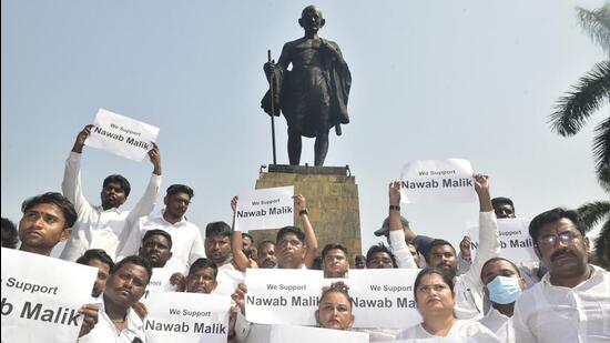 Members of MVA parties at a protest against the arrest of Nawab Malik, on Thursday. Anshuman Poyrekar/HT Photo