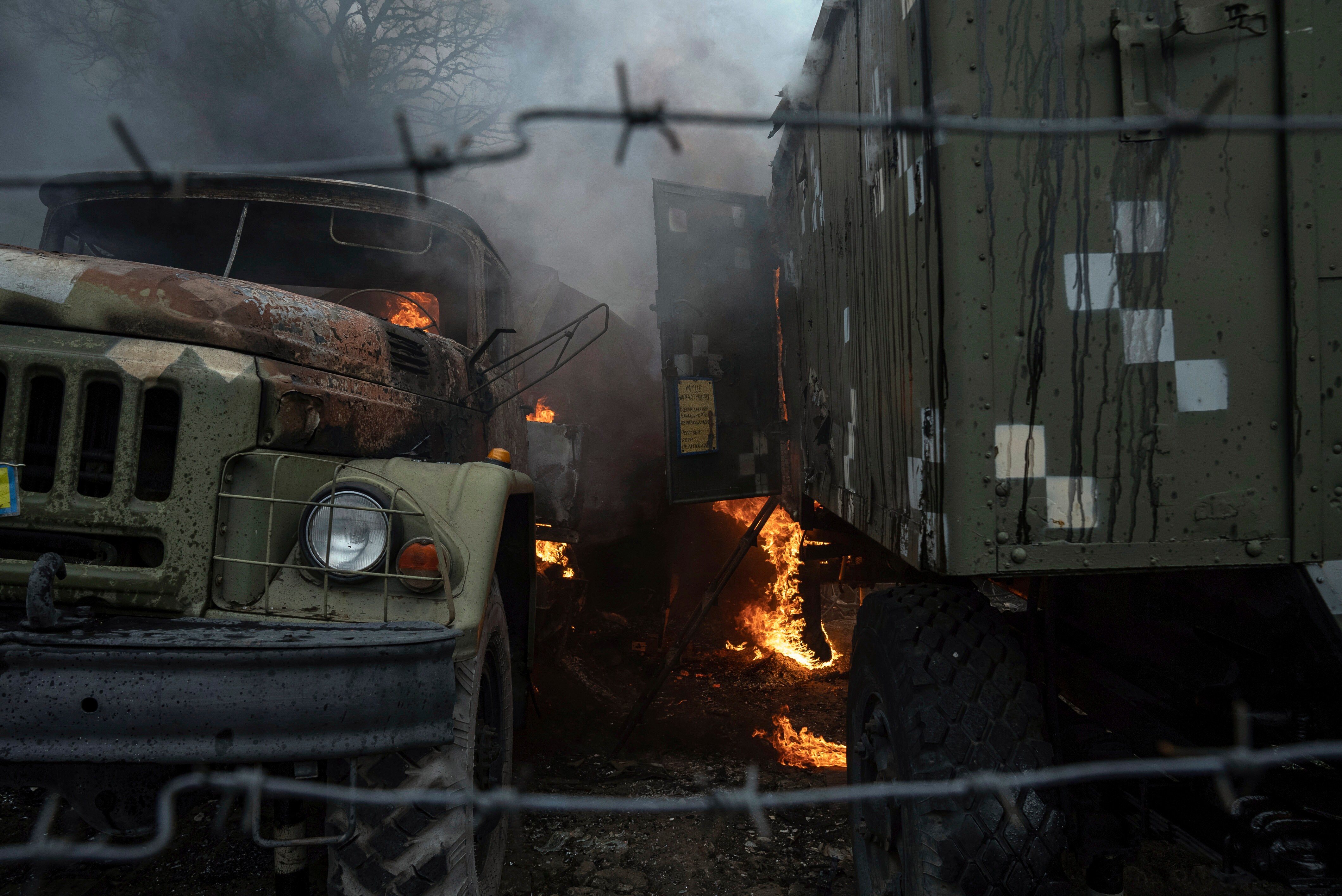 Ukrainian military track burns at an air defence base in the aftermath of an apparent Russian strike in Mariupol, Ukraine, (AP) Ukrainian military track burns at an air defence base in the aftermath of an apparent Russian strike in Mariupol, Ukraine, (AP)