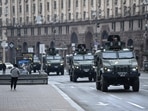 TOPSHOT - Ukrainian military vehicles move past Independence square in central Kyiv on February 24, 2022. (Photo by Daniel LEAL / AFP)(AFP) TOPSHOT - Ukrainian military vehicles move past Independence square in central Kyiv on February 24, 2022. (Photo by Daniel LEAL / AFP)(AFP)