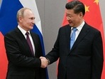 Russian president Vladimir Putin (L) shakes hands with Chinese president Xi Jinping during an earlier meeting on the sidelines of a BRICS summit. (Reuters/File Photo_&nbsp;