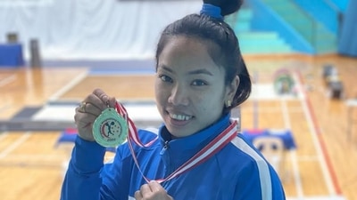 Mirabai Chanu poses with the gold medal at the Singapore International Weightlifting tournament. Mirabai Chanu poses with the gold medal at the Singapore International Weightlifting tournament.