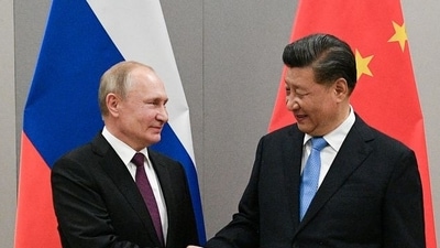 Russian president Vladimir Putin (L) shakes hands with Chinese president Xi Jinping during an earlier meeting on the sidelines of a BRICS summit. (Reuters/File Photo_&nbsp;