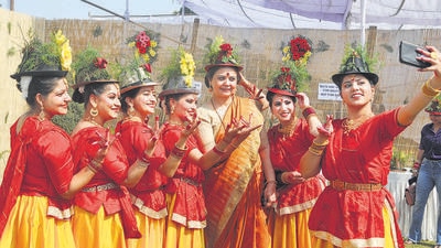Artistes capturing pictures with flower-decked hats after the inauguration of the 50th Rose Festival at the Zakir Hussain Rose Garden in Chandigarh on Friday. (Ravi Kumar/HT)