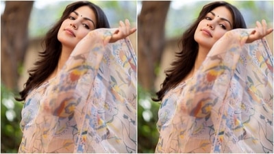 In the end, Rhea styled the ensemble with minimal jewellery and make-up. She chose layered jhumkis with beads and colourful accents matching her saree and nude strappy heels. Centre-parted open locks with wavy ends, nude pink lips, mascara-adorned lashes, and dainty bindi rounded off the glam picks. (Instagram/@rhea_chakraborty) In the end, Rhea styled the ensemble with minimal jewellery and make-up. She chose layered jhumkis with beads and colourful accents matching her saree and nude strappy heels. Centre-parted open locks with wavy ends, nude pink lips, mascara-adorned lashes, and dainty bindi rounded off the glam picks. (Instagram/@rhea_chakraborty)
