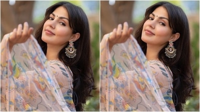 On Thursday, Rhea took to her Instagram page to share images from Farhan and Shibani's post-wedding celebrations and captioned it, "Every little normal thing, gives me happiness." The star donned a blush pink georgette saree and cropped bralette-style blouse from the clothing label Baise Gaba's Hiraeth collection. (Instagram/@rhea_chakraborty) On Thursday, Rhea took to her Instagram page to share images from Farhan and Shibani's post-wedding celebrations and captioned it, "Every little normal thing, gives me happiness." The star donned a blush pink georgette saree and cropped bralette-style blouse from the clothing label Baise Gaba's Hiraeth collection. (Instagram/@rhea_chakraborty)