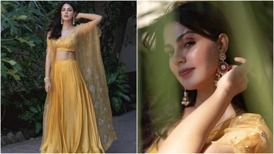 Earlier, Rhea had shared photos of her look from Shibani and Farhan's boho-inspired Mehendi ceremony. She wore a bright canary yellow lehenga set featuring a sleeveless blouse, lehenga skirt and sheer cape jacket. (Instagram/@rhea_chakraborty) Earlier, Rhea had shared photos of her look from Shibani and Farhan's boho-inspired Mehendi ceremony. She wore a bright canary yellow lehenga set featuring a sleeveless blouse, lehenga skirt and sheer cape jacket. (Instagram/@rhea_chakraborty)