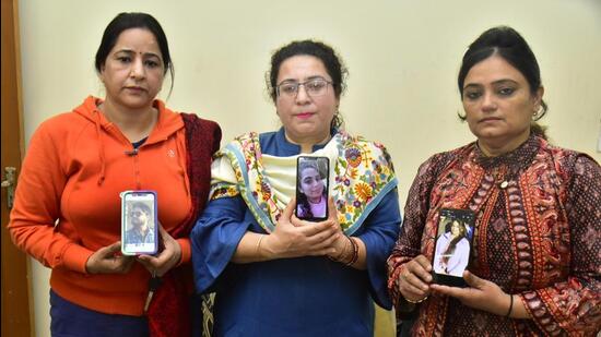 (From left) Mothers of Ambuj Soni, Saumy Hasija and Kaynaat Mahajan show their photographers as they appeal to the Centre for their speedy evacuation, in Amritsar of Punjab on Friday. (Sameer Sehgal/HT)