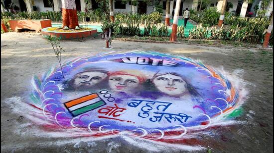 A rangoli urging people to vote seen outside a polling centre in Lucknow, Uttar Pradesh. (ANI Photo)