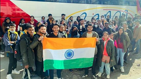 First batch of Indian students holding the national flag before leaving for the Ukraine-Romania border from Chernivtsi, on Friday. (REPRESENTATIVE PHOTO)