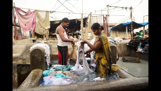 At Dhobhi Ghat in Mumbai. Dhobi Ghat is the world's largest laundry with 800 wash pens with flogging stones. Over 8,000 people work here. In Rochelle Potkar’s Honour, one of the stories in the collection, a washerwoman from Dhobi Ghat battles the odds of life. (Bethany Clarke/Getty Images)