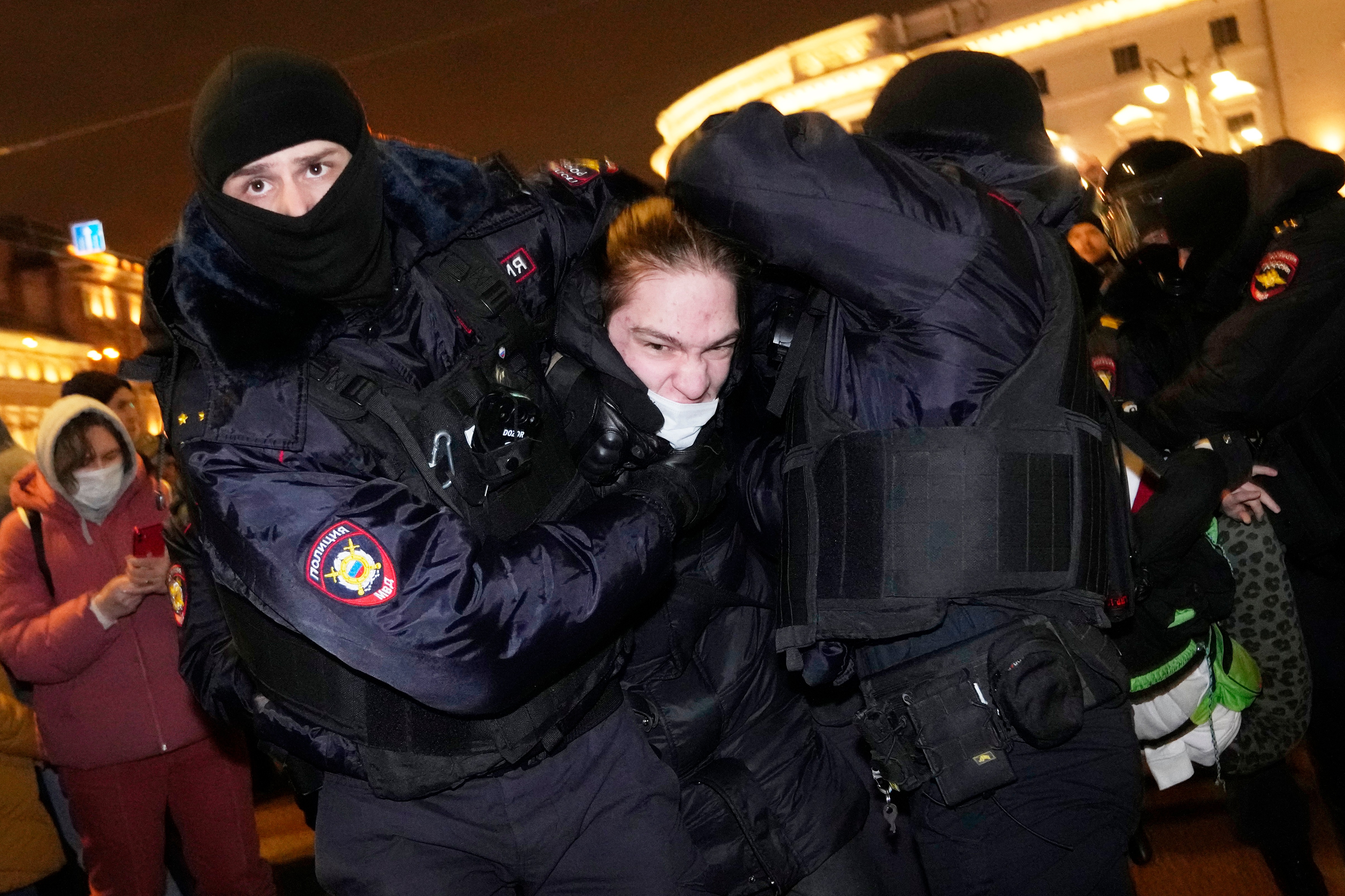 Police officers detain a demonstrator in St. Petersburg, Russia, Thursday, Feb. 24, 2022. (AP) Police officers detain a demonstrator in St. Petersburg, Russia, Thursday, Feb. 24, 2022. (AP)