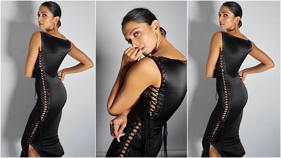 Deepika Padukone in a lace-up vintage black dress. Deepika Padukone in a lace-up vintage black dress.