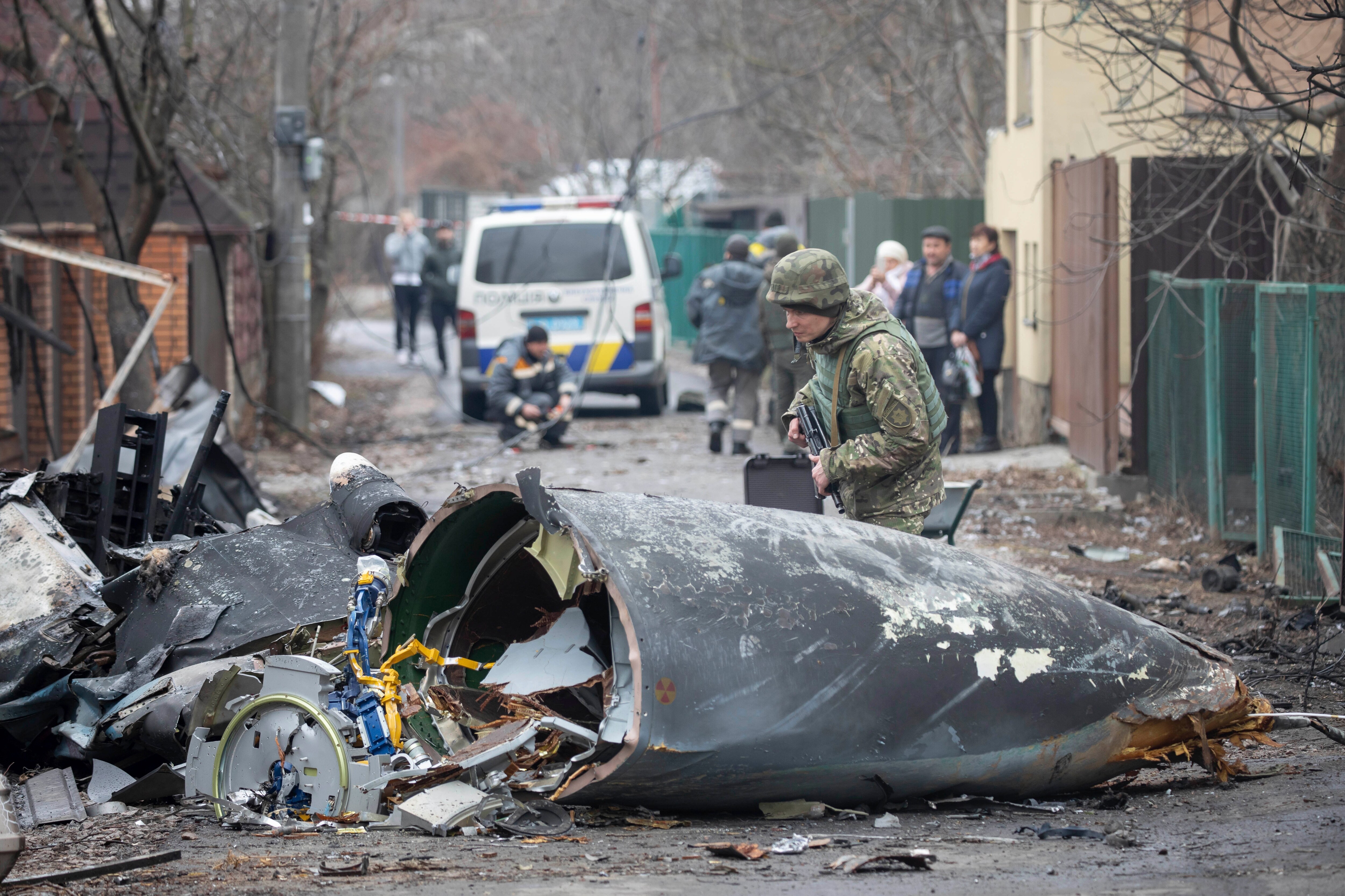 A Ukrainian Army soldier inspects fragments of a downed aircraft in Kyiv, Ukraine, Friday, February. 25, 2022. &nbsp;(AP/PTI) (AP)