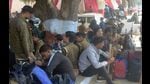 Cops waiting for their rides to head to polling stations on the eve of the voting day in Prayagraj on Saturday. (HT photo)