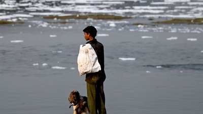 A ragpicker stands on the banks of the river Yamuna in New Delhi. (AFP) A ragpicker stands on the banks of the river Yamuna in New Delhi. (AFP)