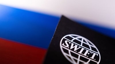 Swift logo is placed on a Russian flag are seen in this illustration taken. (REUTERS)