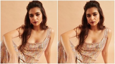 Keerthy paired a sleeveless silver sequined short kurta with a pair of sharara intricately detailed in gold and silver sequins. (Instagram/@keerthysureshofficial)