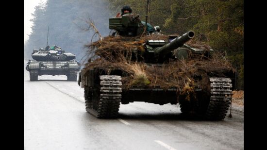 Ukrainian tanks move on a road before an attack in Lugansk region. (AFP)