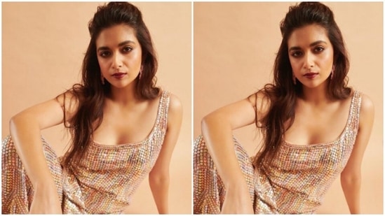 Keerthy paired a sleeveless silver sequined short kurta with a pair of sharara intricately detailed in gold and silver sequins.(Instagram/@keerthysureshofficial)