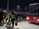 Przemysl, Poland: People wait in a parking lot for buses to arrive with refugees after Russia's invasion against Ukraine on February 26, 2022.&nbsp;