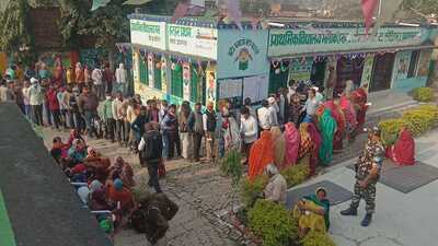 Rural voters stand in queue at their polling station set up at the Government Primary School, Malak Harhar in Phaphamau region of Prayagraj district on Sunday. (HT PHOTO) Rural voters stand in queue at their polling station set up at the Government Primary School, Malak Harhar in Phaphamau region of Prayagraj district on Sunday. (HT PHOTO)