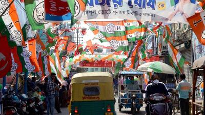 People commuting on a road displaying flags of various parties during the West Bengal civic polls, at Chandannagar, in Hooghly on Sunday. (ANI PHOTO.) People commuting on a road displaying flags of various parties during the West Bengal civic polls, at Chandannagar, in Hooghly on Sunday. (ANI PHOTO.)