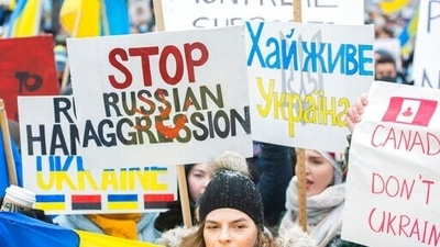 People take part in a rally in support of Ukraine in Montreal. (AP) People take part in a rally in support of Ukraine in Montreal. (AP)