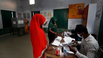 Election officers check the identity of voters before allowing her to cast her vote at a polling station during the fifth phase of Uttar Pradesh state legislature elections, in Patel Nagar,Dubepur Sultanpur district , Uttar Pradesh. (AP) Election officers check the identity of voters before allowing her to cast her vote at a polling station during the fifth phase of Uttar Pradesh state legislature elections, in Patel Nagar,Dubepur Sultanpur district , Uttar Pradesh. (AP)