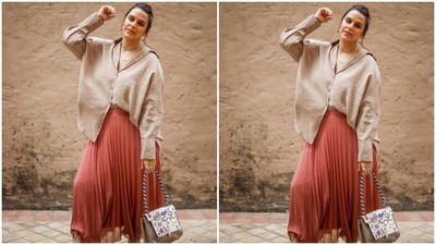 Neha played muse to the designer house Zara and picked an ivory white shirt and a peach satin skirt for the pictures. (Instagram/@nehadhupia)