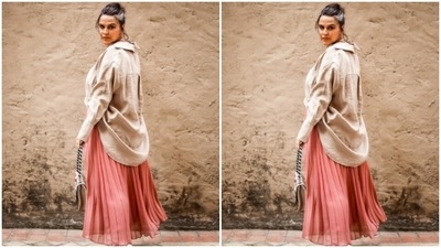 Styled by fashion stylist Ayesha Khanna, Neha wore her tresses into a bun with a few strands left free around her face. In multicolour hoop earrings, Neha added the necessary pop of colour to her look. (Instagram/@nehadhupia)