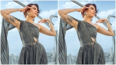 Mandana's gown came with a dramatic sleeve detail in one side and off-shoulder in the other. The gown added more sass to her look with a grey satin belt near the waist decorated with a golden buckle. (Instagram/@mandanakarimi)
