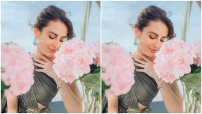 Mandana wore her tresses into a messy bun and left her fringes open in wavy curls to fall around her forehead. (Instagram/@mandanakarimi)