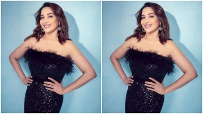 Madhuri's off-shoulder black dress came with black fur details at the top and at the knees. Decorated in silver sequins, Madhuri added more details to her look with a black sleek belt at the waist. (Instagram/@madhuridixitnene)