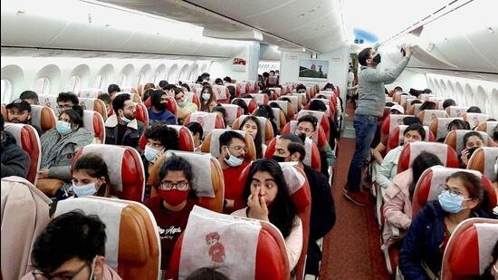 Indian nationals board a special Air India flight, evacuating Indians from war-torn Ukraine, in Bucharest. (PTI)