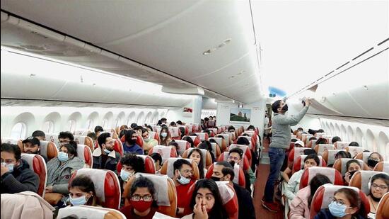 Indian nationals board a special Air India flight, evacuating Indians from war-torn Ukraine, in Bucharest. (PTI)