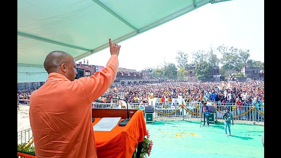 Chief Minister Yogi Adityanath addressing a public meeting for the state Assembly elections, in Gorakhpur on Sunday. (AGENCY)