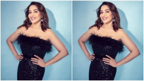 Madhuri's off-shoulder black dress came with black fur details at the top and at the knees. Decorated in silver sequins, Madhuri added more details to her look with a black sleek belt at the waist.(Instagram/@madhuridixitnene)