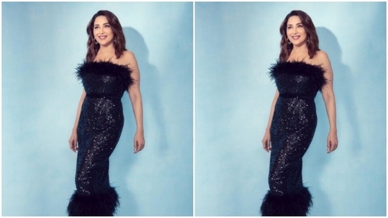 Styled by fashion stylist Ami Patel, Madhuri wore her tresses open in wavy curls with a side part as she smiled for the pictures.(Instagram/@madhuridixitnene)