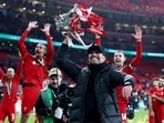 Liverpool manager Juergen Klopp celebrates with the trophy after winning the Carabao Cup