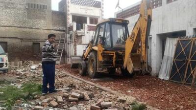 In Zone D, the Ludhiana MC demolished the illegal second floor of a commercial building on College Road, sealed two commercial shops in Ghumar Mandi and on Chaar Khamba Road in Model Town, razed a colony in Jawaddi, and removed encroachment on a portion of the road by a home owner in Model Town Extension. (HT Photo) In Zone D, the Ludhiana MC demolished the illegal second floor of a commercial building on College Road, sealed two commercial shops in Ghumar Mandi and on Chaar Khamba Road in Model Town, razed a colony in Jawaddi, and removed encroachment on a portion of the road by a home owner in Model Town Extension. (HT Photo)