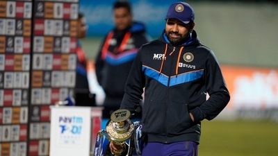 India's captain Rohit Sharma carries the winners trophy after their win in the third Twenty20 international cricket match against Sri Lanka in Dharmsala, India, Sunday, Feb. 27, 2022. India won the series 3-0 (AP) India's captain Rohit Sharma carries the winners trophy after their win in the third Twenty20 international cricket match against Sri Lanka in Dharmsala, India, Sunday, Feb. 27, 2022. India won the series 3-0 (AP)