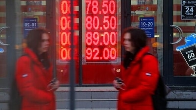 Russia's ruble plunged nearly 30 percent against the dollar. (AP)