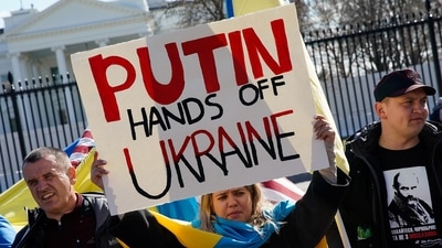 A demonstrator holds up a sign during a "Stand with Ukraine" rally against the Russian invasion of Ukraine, in front of the White House in Washington, U.S., February 28, 2022.&nbsp; (REUTERS)