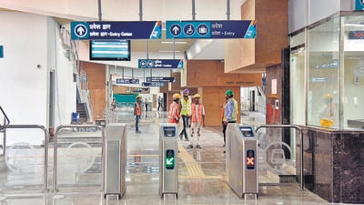 Beautification work underway at Anandnagar Metro station, Kotharud, on Monday. Prime Minister Narendra Modi will inaugurate two metro stations on March 6. (Hindustan Times) Beautification work underway at Anandnagar Metro station, Kotharud, on Monday. Prime Minister Narendra Modi will inaugurate two metro stations on March 6. (Hindustan Times)